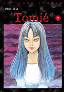 A coloured manga cover depicting a typical Tomie pose.  Demure and threatening underneath.