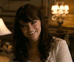 I loved Emma Stone's hair in this movie. The side swept bangs and bouncy wavy hair made her darkly lined eyes that much more feminine!