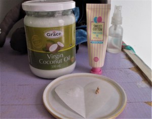 Look at the paper heart. See the dab of foundation/bb, and the drop of solid coconut oil? That's all that's needed to make an amazing sheer coverage. (fyi, coconut oil melts as you mix it in your palm...